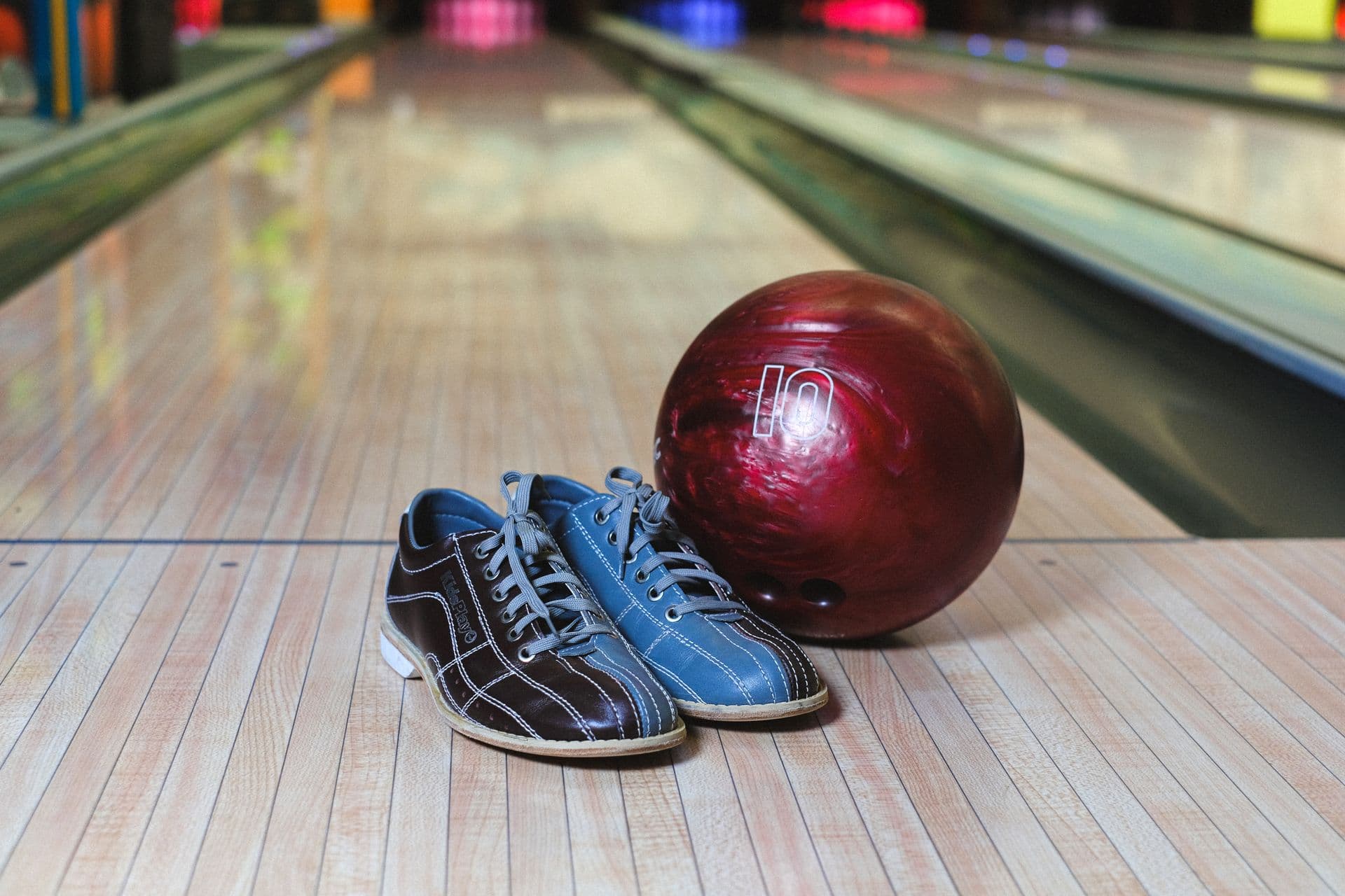 Bowling shoes and ball on the lane